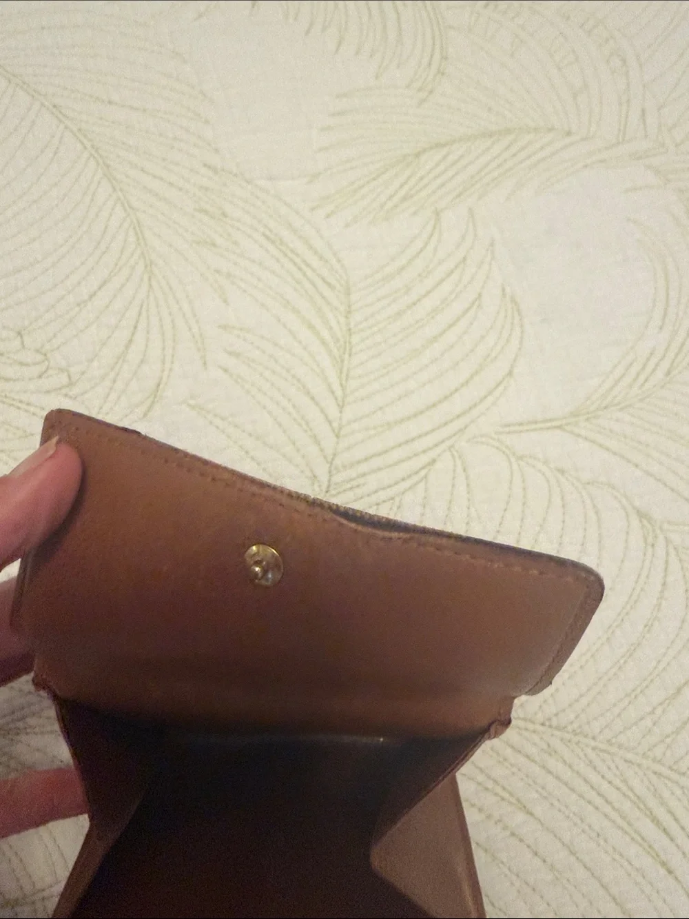 Louis Vuitton trifold snap wallet. Authentication provided.